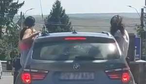 Distracția costă! Două tinere din Suceava, amendate după ce s-au plimbat ieşite pe jumătate pe geamurile unei mașini (VIDEO)