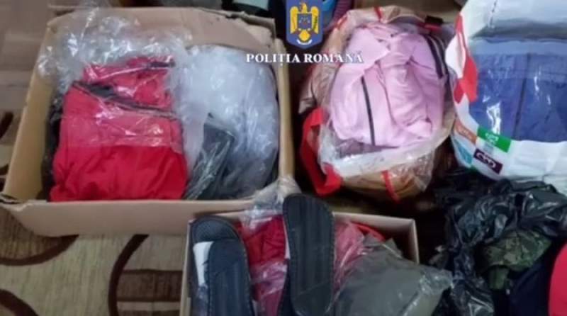 Percheziții în Alba la escroci care vindeau online haine contrafăcute (VIDEO)