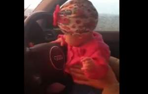 Clujean filmat în timp ce conduce cu fetita în brațe (VIDEO)